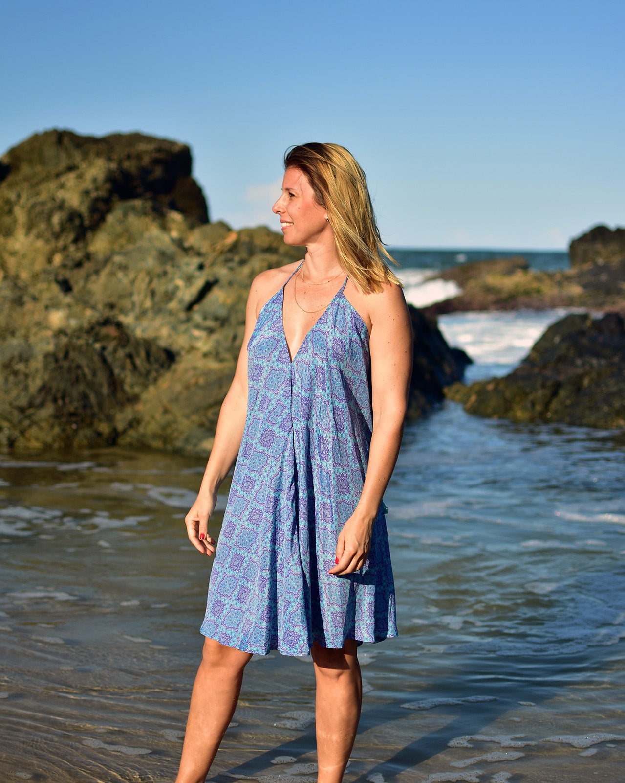 Adicora Silk Mini Dress in vibrant blue geometric print with halter neckline and low back