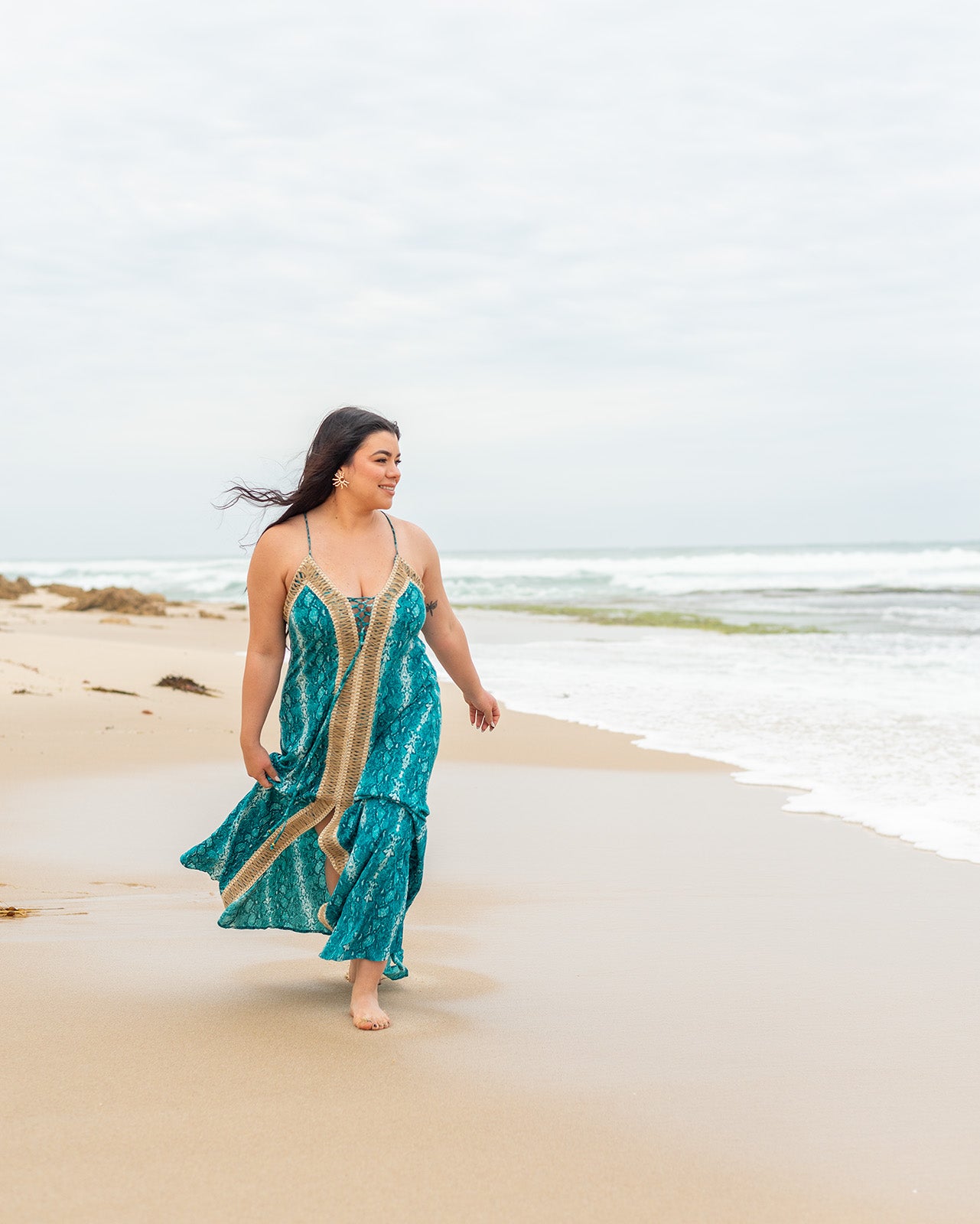 Banksia Maxi Dress featuring striking snake print in deep blues with deep V-neckline