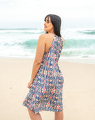 Flowy Cata Mini Dress showcasing an open-back detail and adjustable straps for a perfect fit