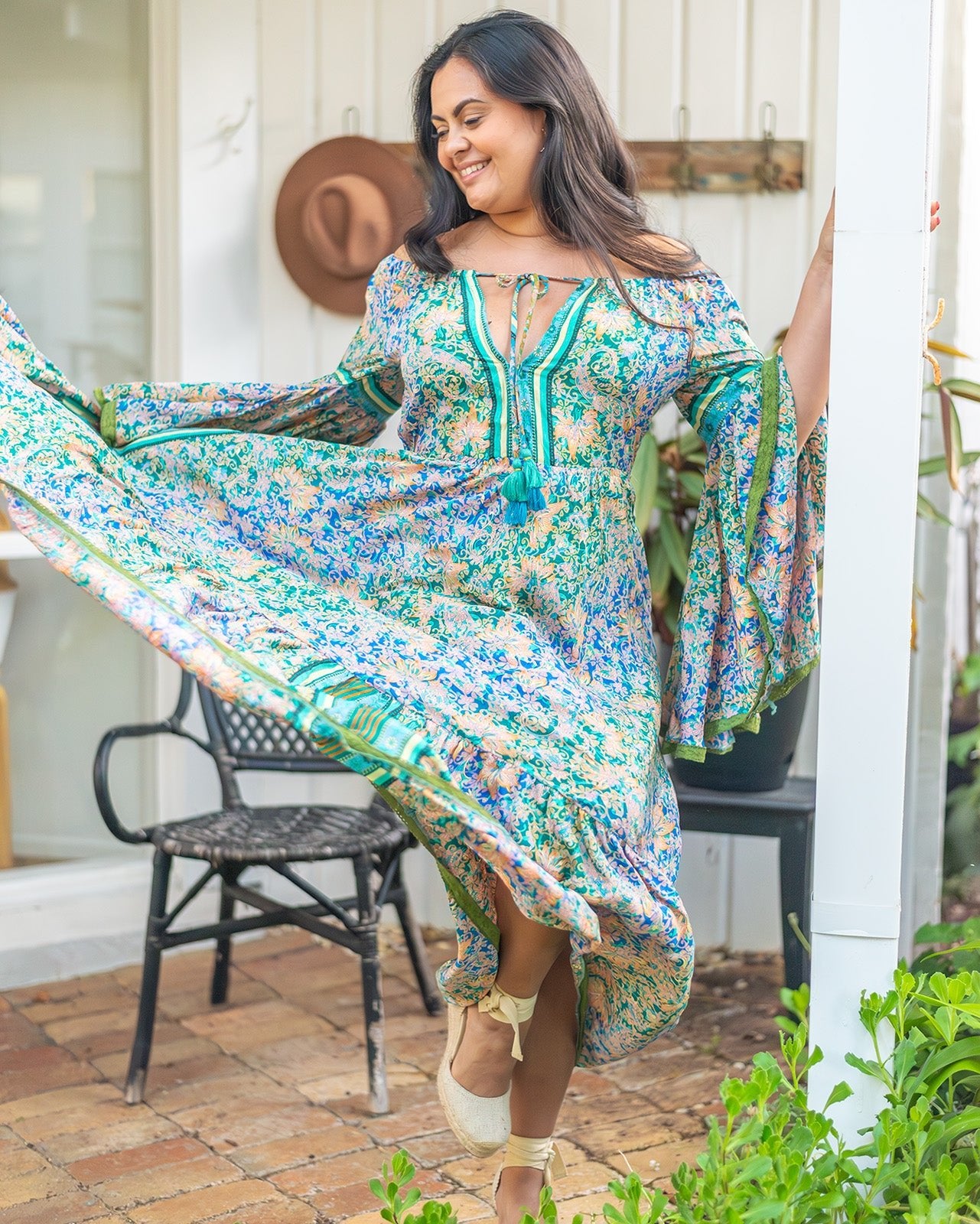 Dromana Maxi Dress featuring intricate floral print in blues and greens with deep V-neckline