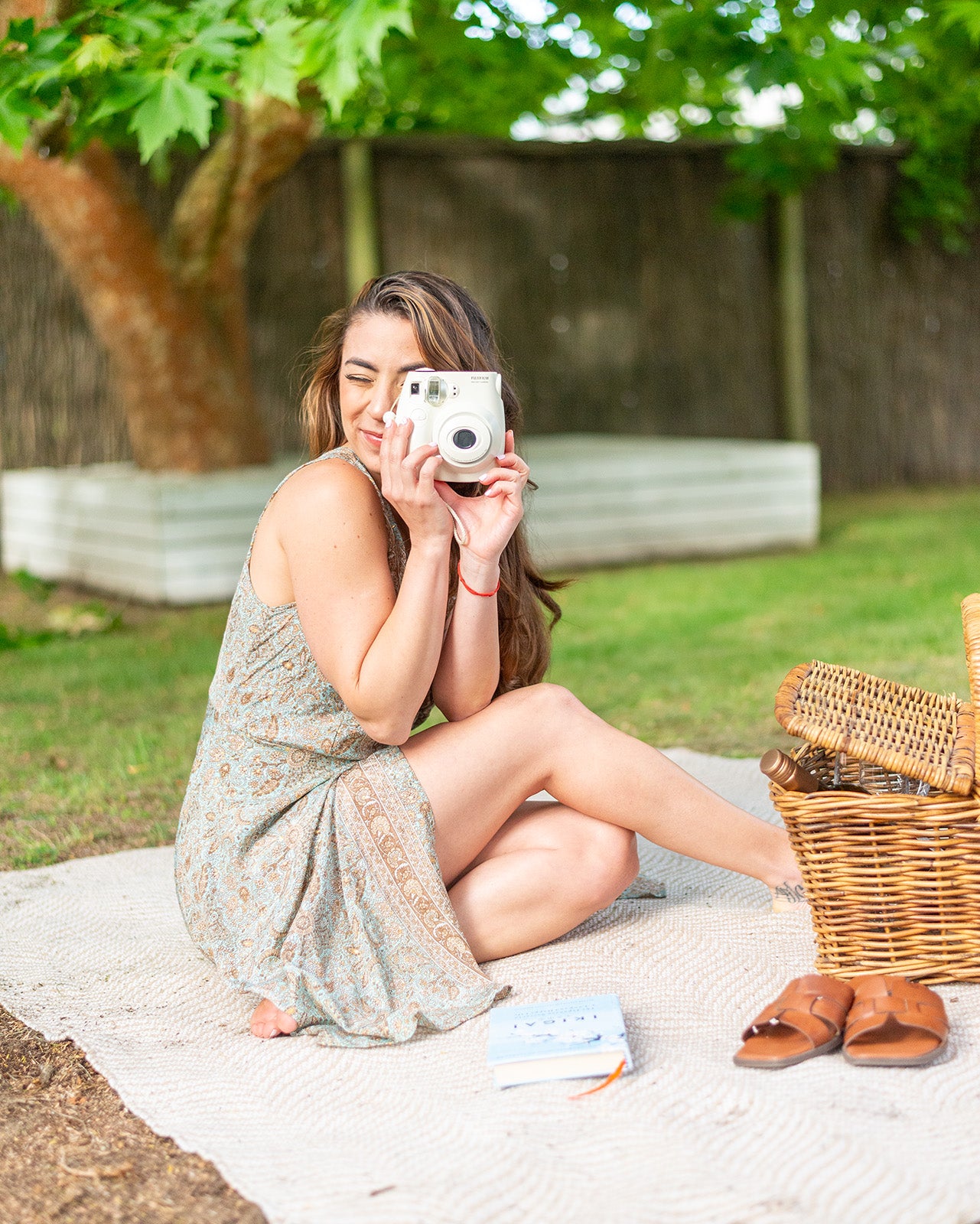 Eden Mini Dress featuring a delicate V-neck and unique boho print in blue, gold, and brown