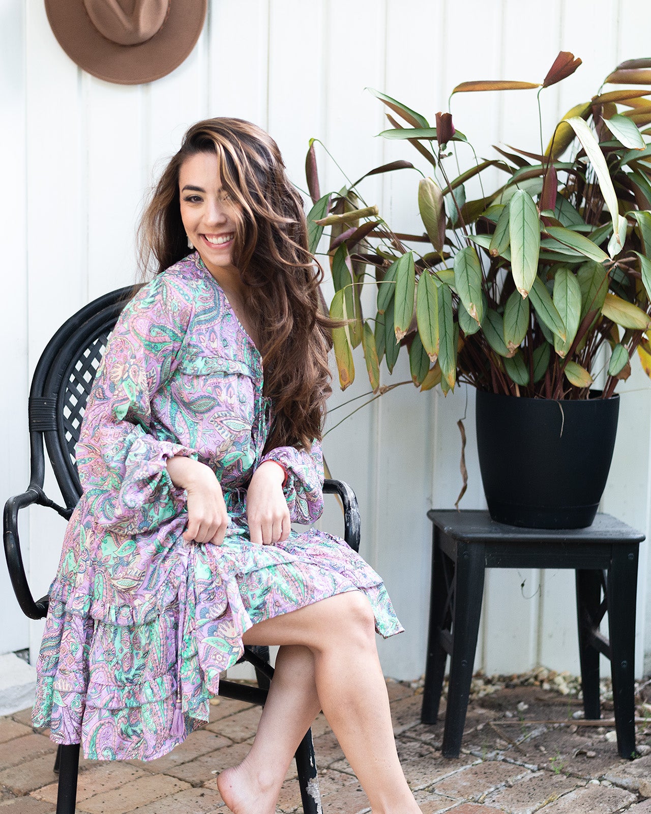 Nova Midi Dress showcasing a vibrant paisley print in lilac and green with long sleeves
