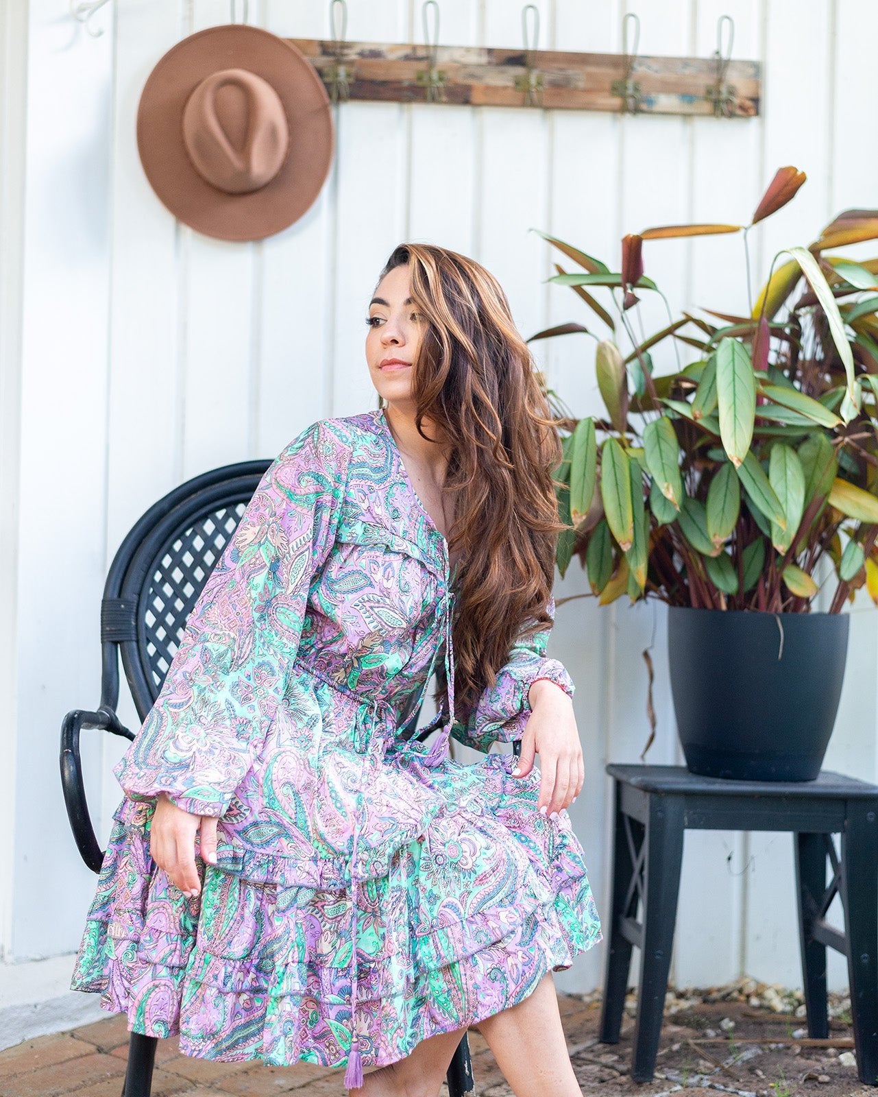 Nova Midi Dress showcasing a vibrant paisley print in lilac and green with long sleeves
