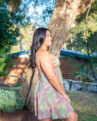 Piper Mini Dress featuring a vibrant paisley print in pink and green with adjustable halter neck