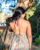 Piper Mini Dress featuring a vibrant paisley print in pink and green with adjustable halter neck