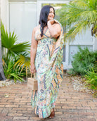 Quinn Maxi Dress showcasing vibrant paisley patterns in mint, peach, and soft yellow