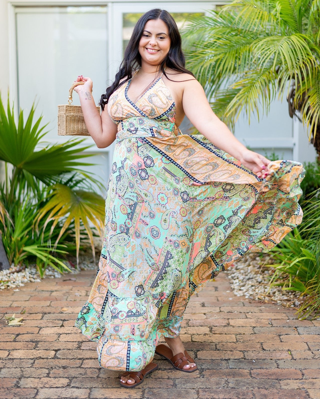 Quinn Maxi Dress showcasing vibrant paisley patterns in mint, peach, and soft yellow
