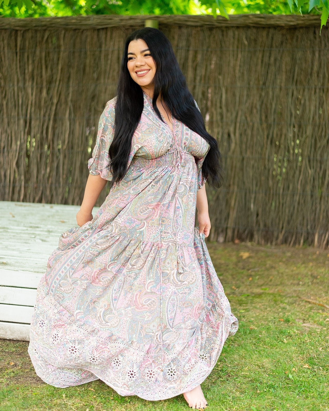 Shyla Maxi Dress featuring a pastel paisley print with embroidered bottom detail
