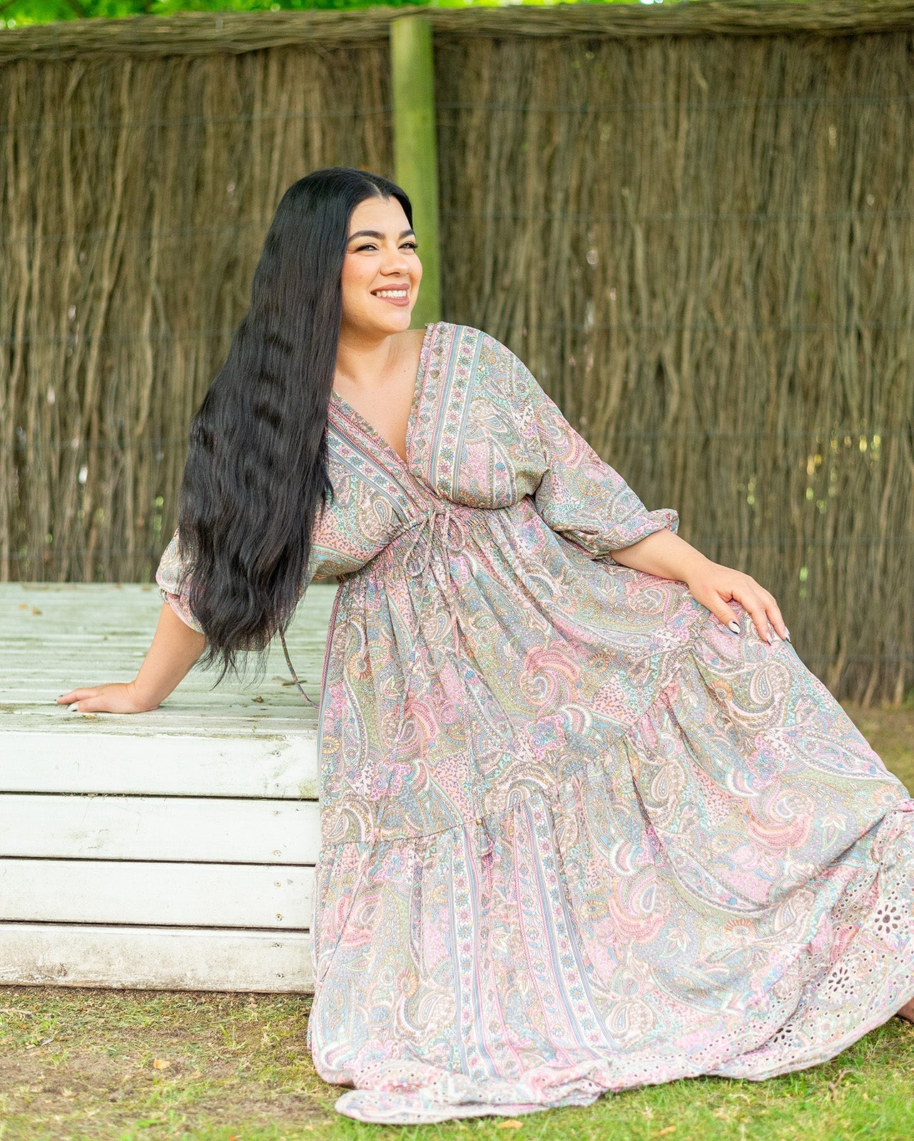 Shyla Maxi Dress featuring a pastel paisley print with embroidered bottom detail